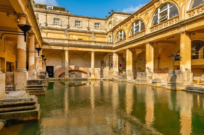 The Great Bath lit by warm evening light