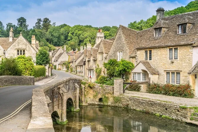 A stone bridge and cottages in a Cotswold village