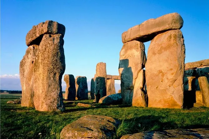 Sarsen stones and lintels at Stonehenge in warm light